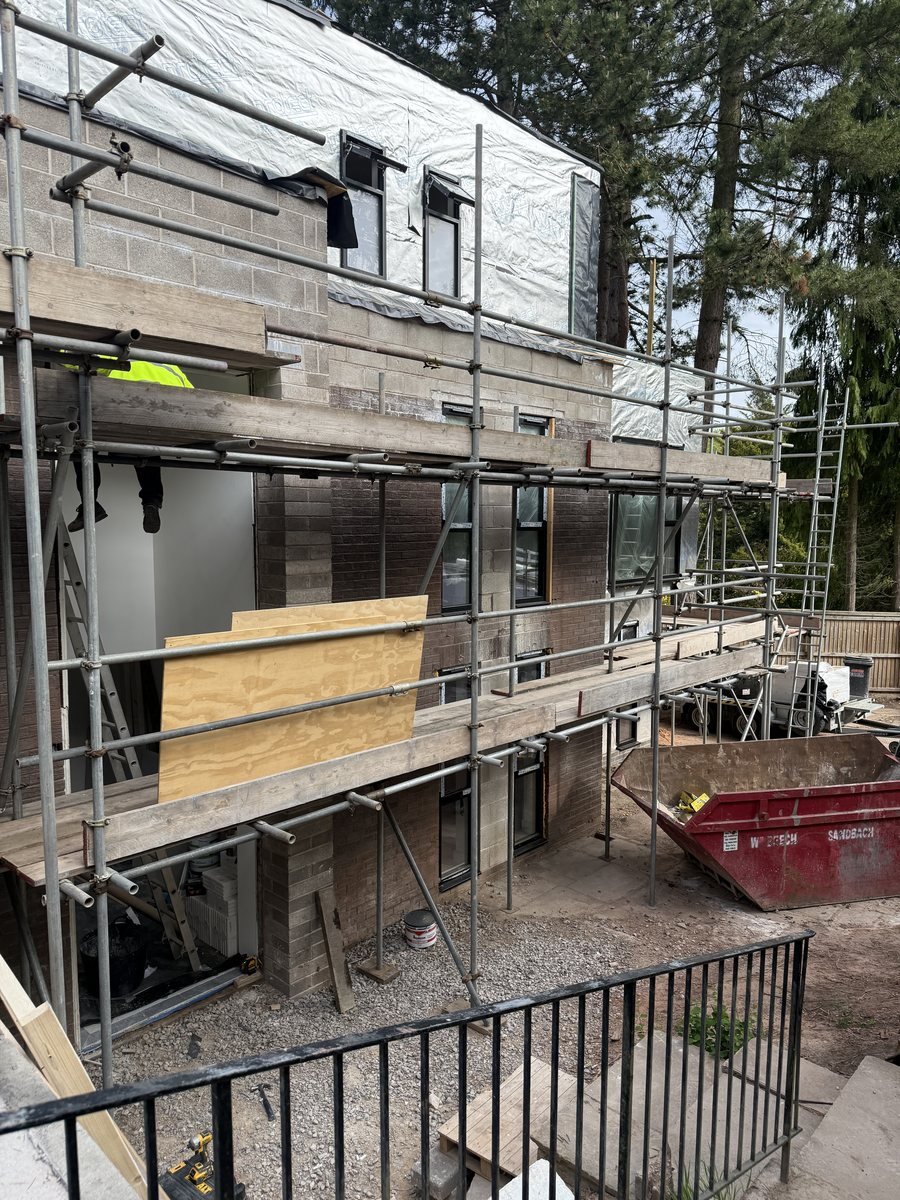 Front corner of the new-build under scaffold before brick slip cladding